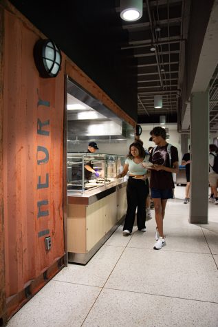 Colorado State Univeristy students fill their bowls for lunch at the Theory station in The Foundry