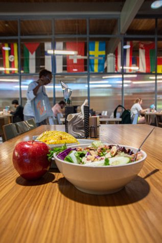 Tacos, salad bowl and an apple in the cafeteria of The Foundry