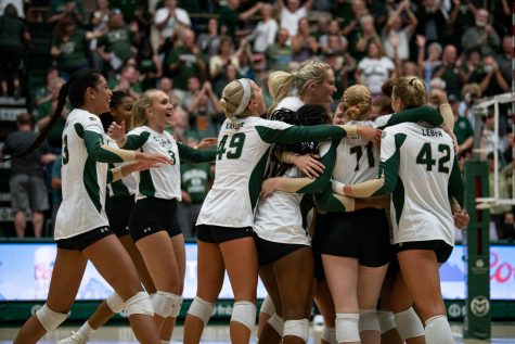 The Colorado State University volleyball team huddles after winning their game against the North Carolina Tarheels at Moby Arena