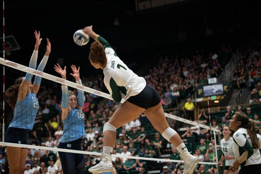 Colorado State University middle blocker Malaya Jones (1) intercepts the ball during a CSU volleyball game against the North Carolina Tarhills.  The game on 26 August resulted in a 25–17 CSU victory.
