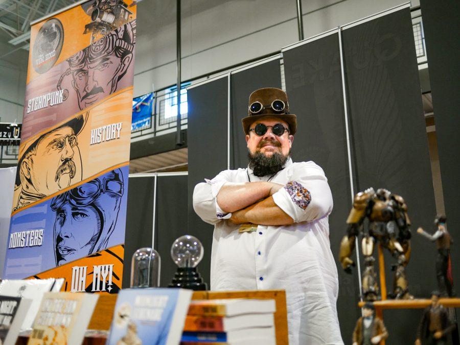 Author Terry Mark stands at his table at the Fort Collins Comic Con