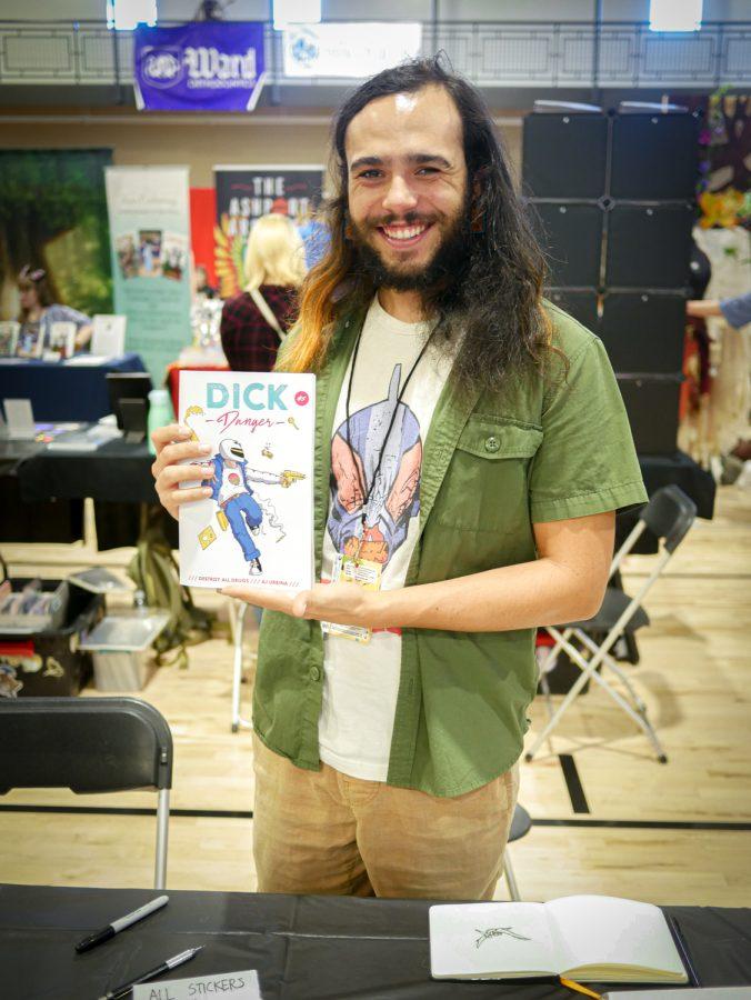 AJ Urbina holds up his graphic novel ‘Dick Danger’ at the Fort Collins Comic Con