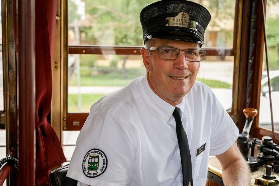 Motorman Greg Koch sits in the operating seat of the Fort Collins Trolley Car 25