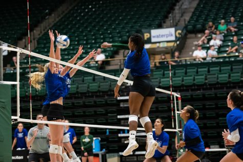 Colorado State outside hitter Kennedy Stanford spikes the ball as Annie Sullivan jumps up to block during the Colorado State volleyball open practice Aug. 10.