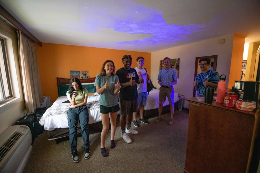 Julian Gordon, Josephine Rupe, Alejandra Flores, Hailey Rageth, Kellen Sisco, Bruno Pardo and Chris Rodier poses for a group photo inside one of the Fort Collins Best Western University Inn four-person dorm rooms Aug. 23