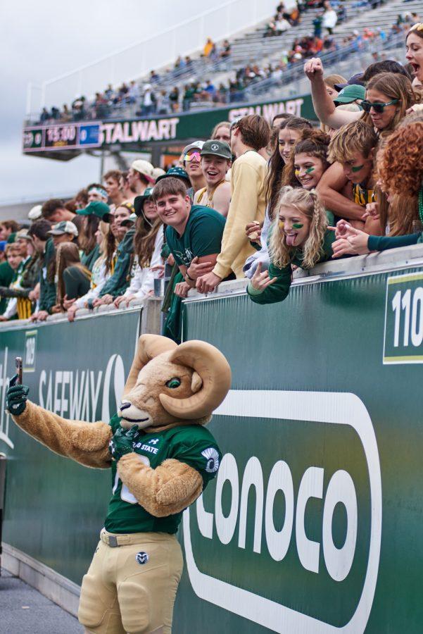 Cam the Ram takes a selfie with fans from the field during the football season opener game against Middle Tennessee State University at Canvas Stadium