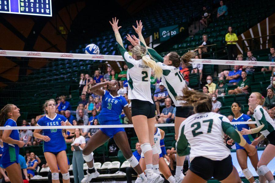 Colorado State University volleyball players attempting to block a spike during the Colorado State University vs Florida Gulf Coast University game on Sep. 2. Colorado State won 3-1.