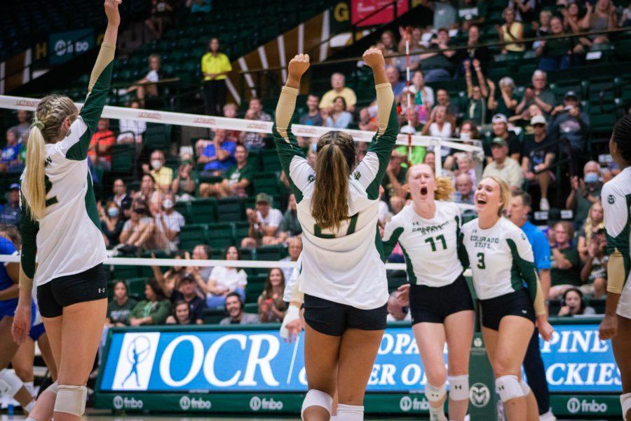 Colorado State University volleyball players celebrating after scoring a point during the Colorado State University vs Florida Gulf Coast University game on Sep. 2. Colorado State won 3-1.
