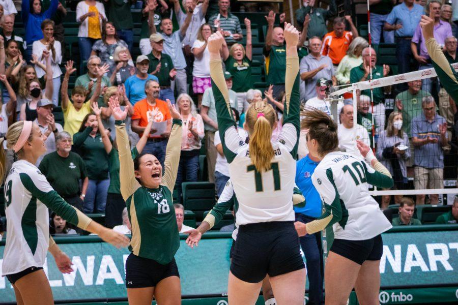 Colorado State University volleyball players celebrating after scoring a point during the Colorado State University vs Florida Gulf Coast University game on Sep. 2. Colorado State won 3-1.