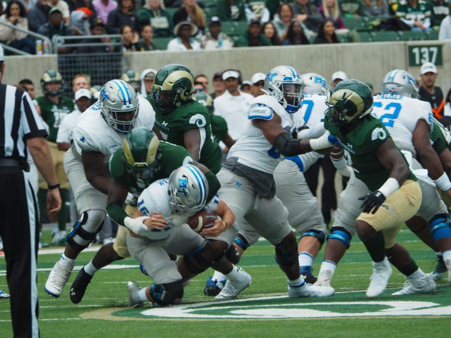 Colorado State defensive back Mohamed Kamara (42) sacks Middle Tennessee quarterback Chase Cunningham (16) Sept. 10. The Rams lost 34-19 to the visiting Blue Raiders