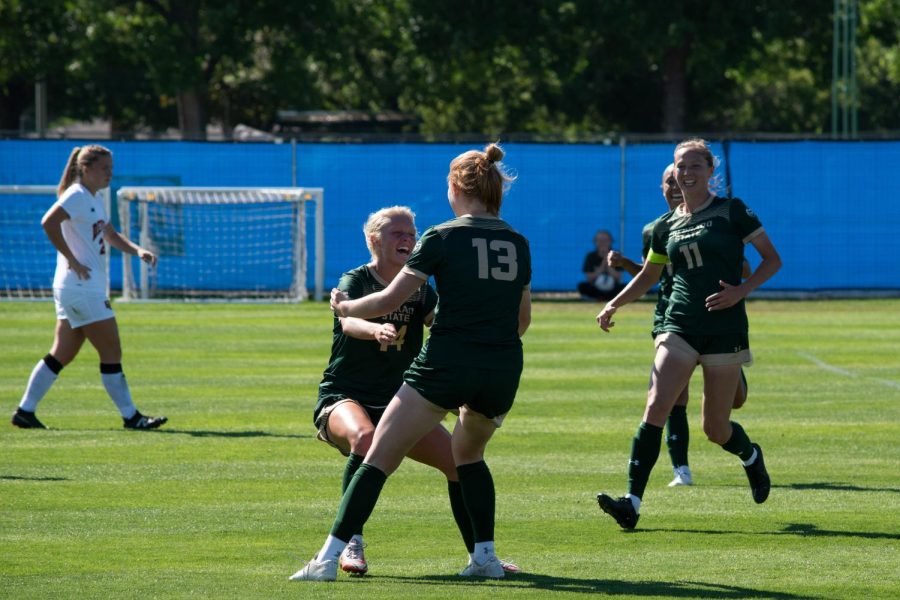 Colorado State midfielder Katy Coffin (14) runs to embrace forward Aleyse Evers (13) after a goal scored by Evers against the University of Denver Sept 11.