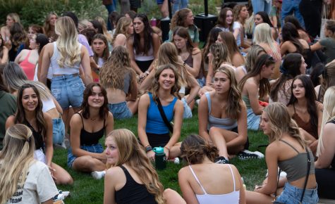 Colorado State University students sit on the lawn at the Lory Sculpture Garden Sept. 20.