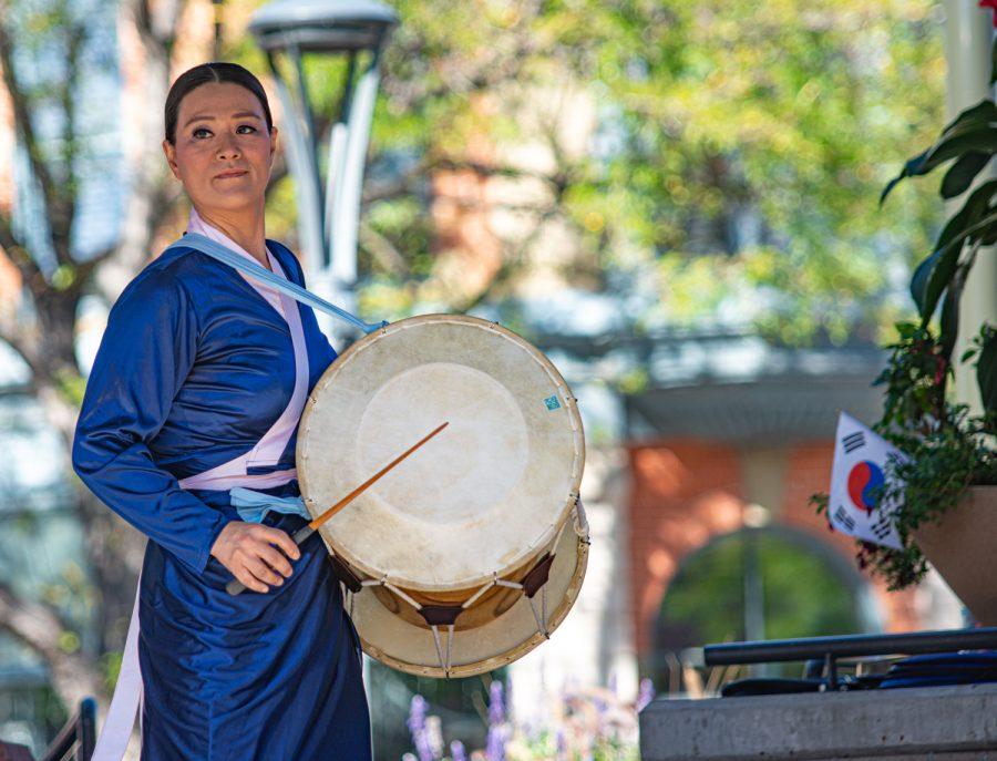 Ja Kyung Kim, Korean traditional drums performer, plays the janggu at the second Annual Korean culture festival in Old Town Square