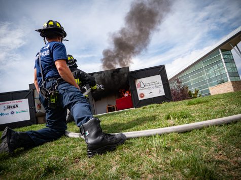 Firefighters from the Poudre Fire Authority demonstrate how to properly work the water hose near the Recreational center at Colorado State University