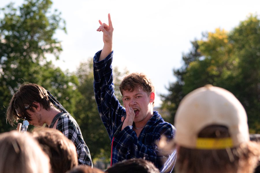 Logan Baker, lead singer of the band Neighborhood Watch, performs on the Lory Student Center lawn with the rest of his group including, CJ Herbert, Ian McMurry, Toby Yoder, and Sage Franks Sept. 16.