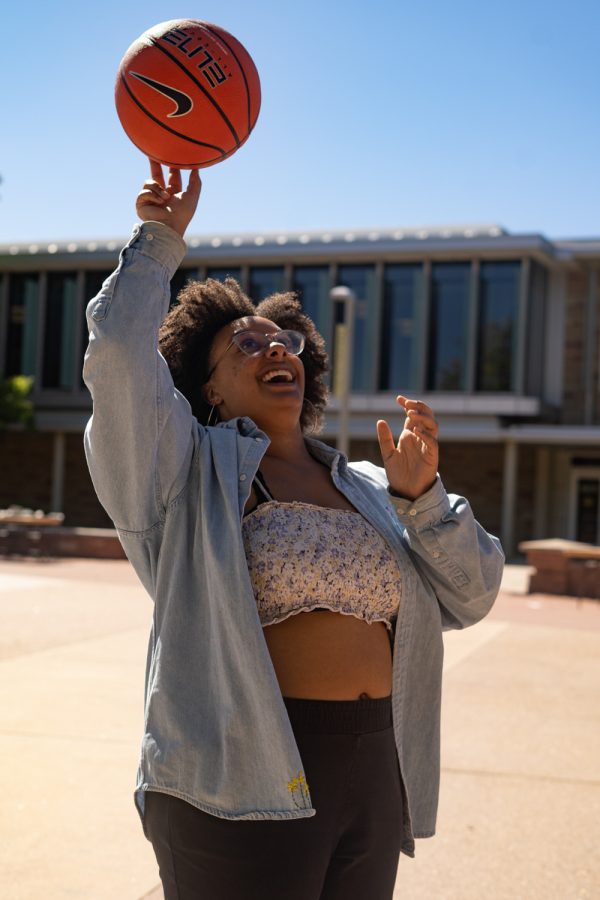 Savannah Johnson plays with a basketball on the Plaza during Kick B/AACC. 