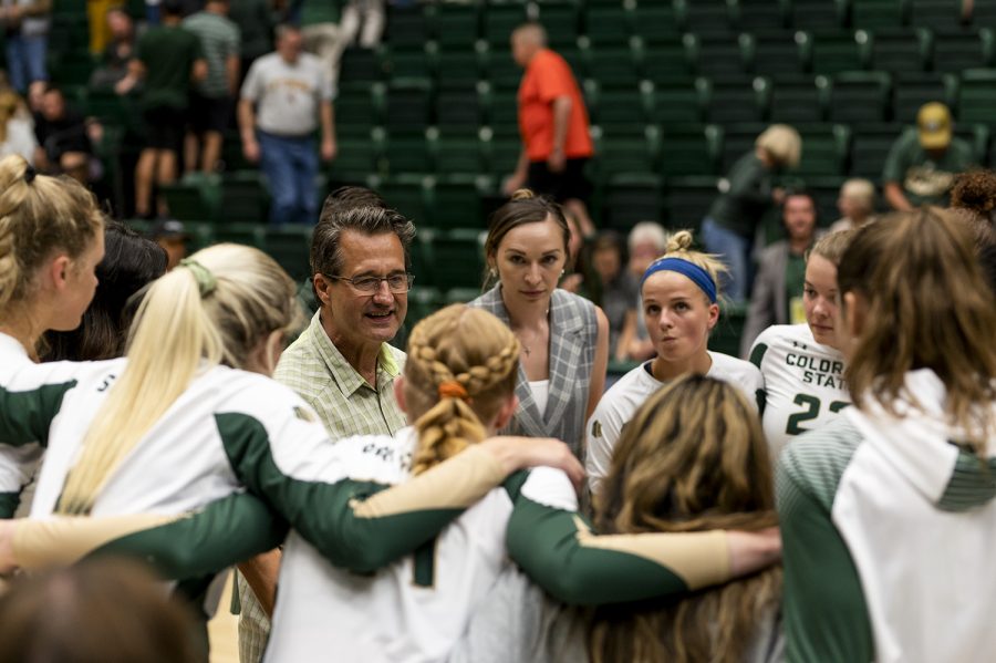 Colorado State University Head Coach Tom Hilbert speaks to the team after the final set against the University of Wyoming