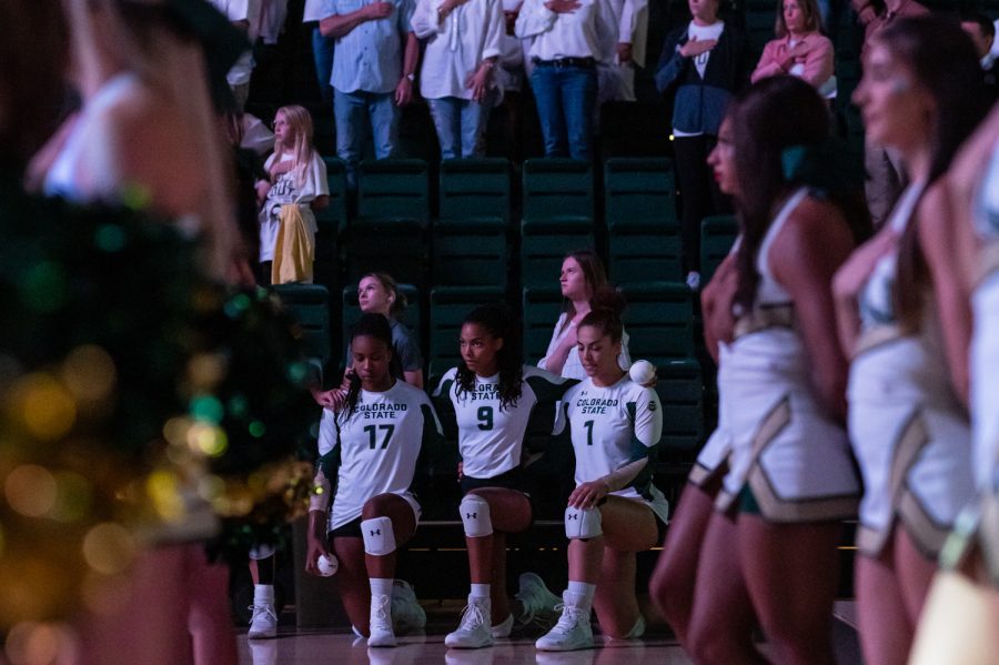 Outside+hitter+Kennedy+Stanford+%2817%29%2C+middle+blocker+Naeemah+Weathers+%289%29+and+middle+blocker+Malaya+Jones+%281%29+kneel+during+the+National+Anthem+before+taking+the+court+against+the+University+of+Colorado