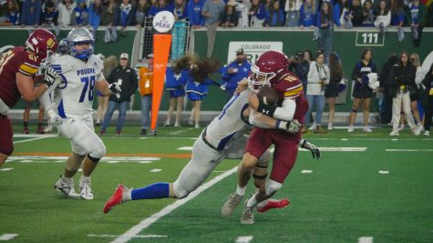 Poudre mike linebacker Brady Brown (11) sacks Rocky Mountain quarterback Gage Brook (16) Sept 30. 