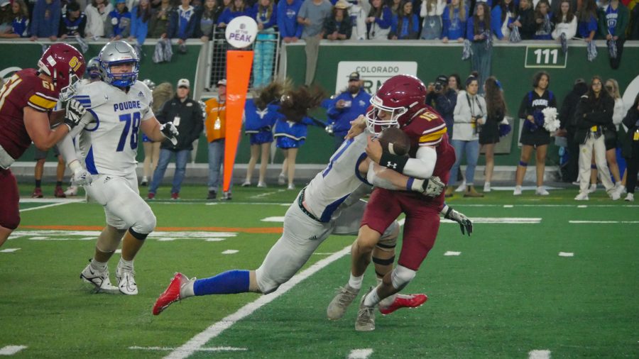 Poudre mike linebacker Brady Brown (11) sacks Rocky Mountain quarterback Gage Brook (16) Sept 30. The Impalas beat the Lobos 34-7.