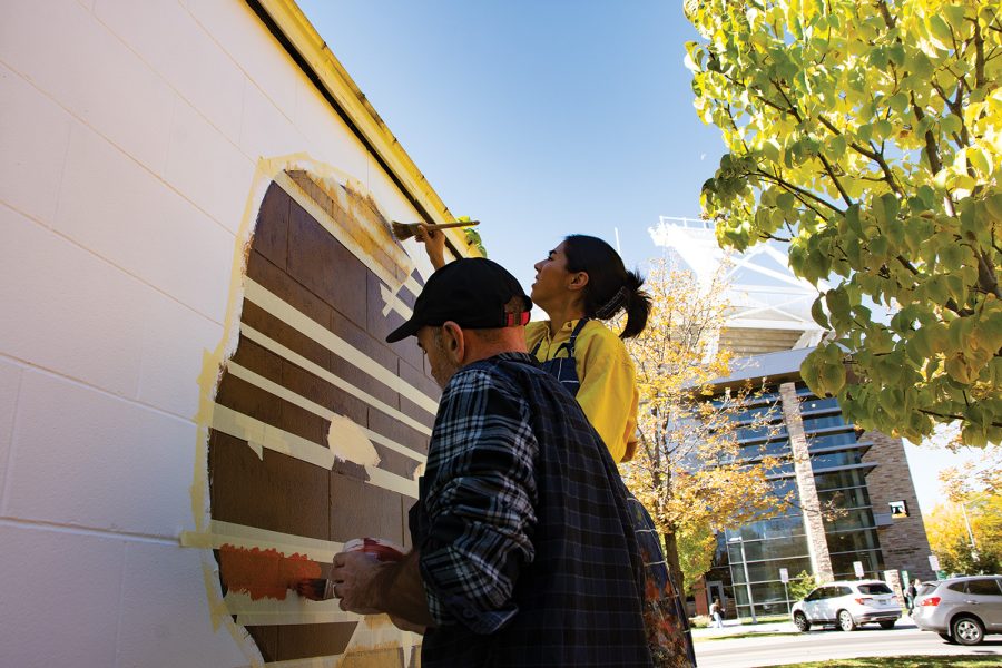 Aitor Lajarin-Encina, assistant professor of painting, and Sam Hamilton, master student of fine arts at Colorado State University, works to transfer a vision of an Alaskan Native American artist