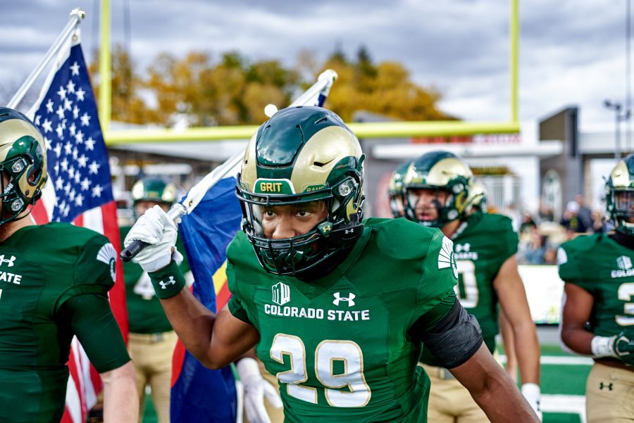 Running back Alex Berrouet (29) runs out to the field at the start of Colorado State University’s homecoming game against Utah State University