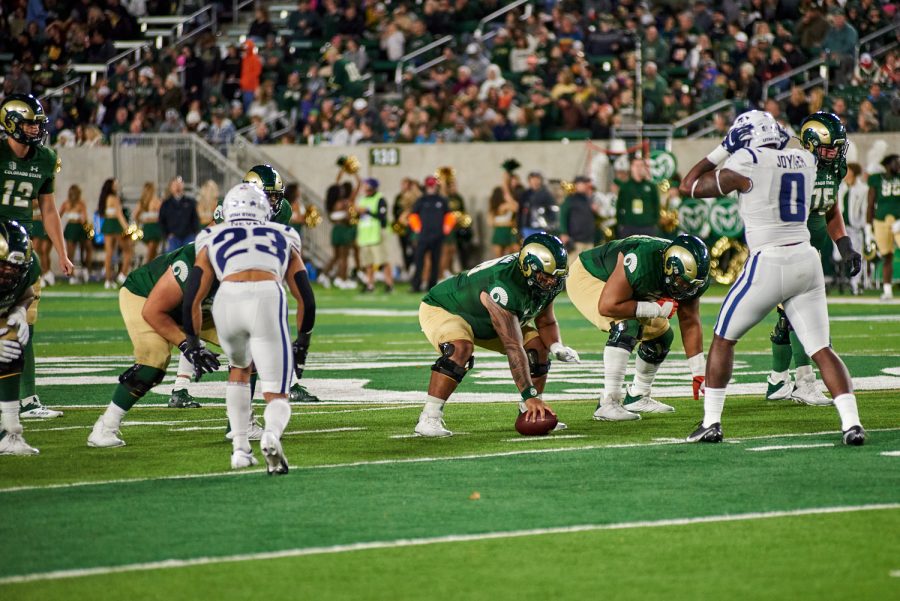 Center, George Miki-Han (58) waits for his queue to snap the ball Oct 15. The offense struggled to find much success throughout the game, settling for field goals both times they were inside the red zone. This ultimately cost them the game, losing 17-13 to the Utah State Aggies. 