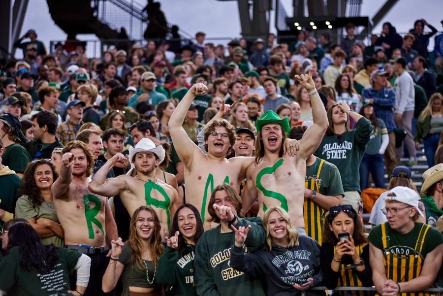 Colorado State University fans with the word 'RAMS' painted on their chest 