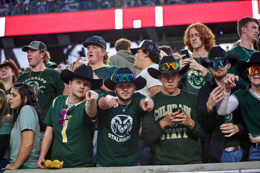 The Outlaws cheer during Colorado State University's homecoming football game 