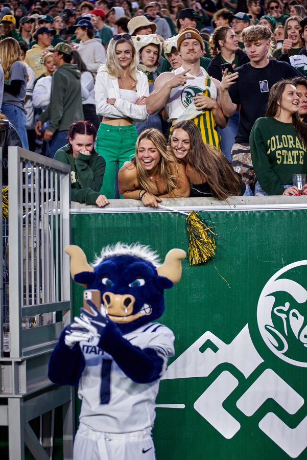 Fans take a selfie with Utah State’s mascot 'Blue' at the homecoming game, Oct 15. Colorado State University lost 17-13 to Utah state.