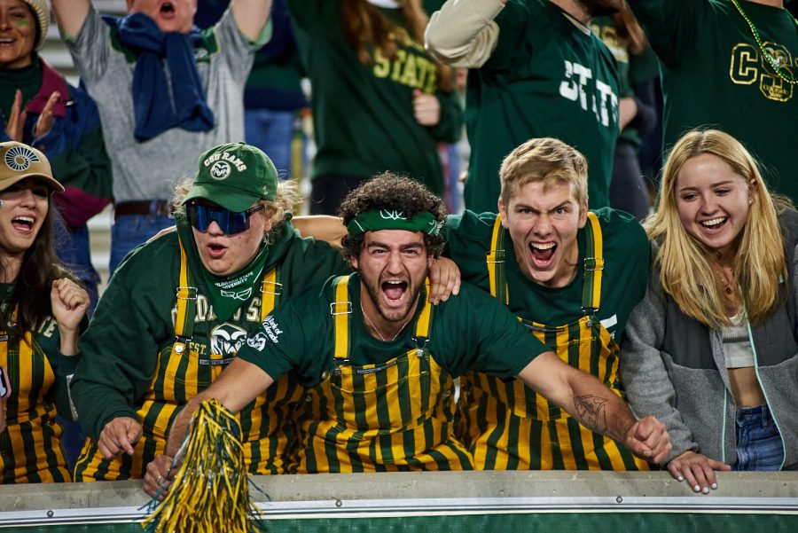 Colorado State University fans wear game day bibs while cheering for the team during the homecoming game