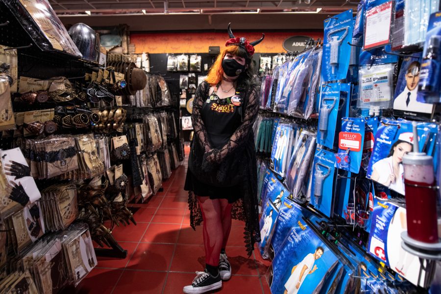Alex Barrow an employee at the Spencers owned Spirit of Halloween store located at 4336 South College Avenue in Fort Collins Colorado stands in one of the hallways filled with costumes