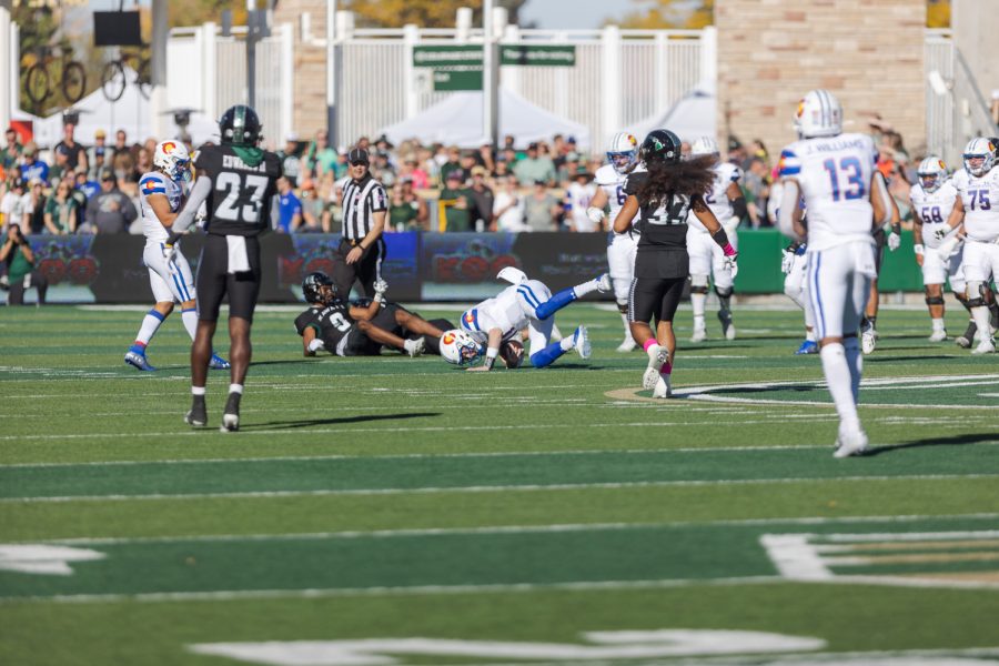 Colorado State University Quarterback Clay Millen tumbles while running the ball