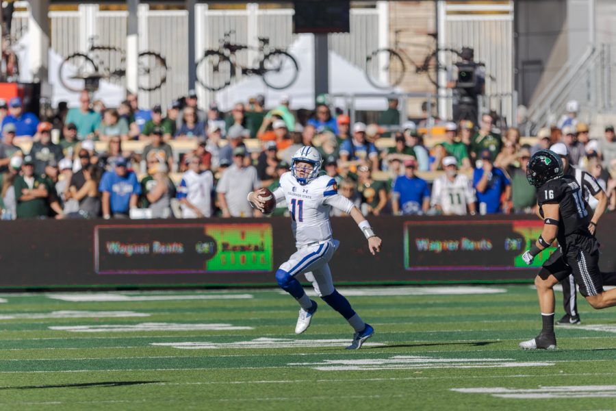 Colorado State University Quarterback Clay Millen runs the ball