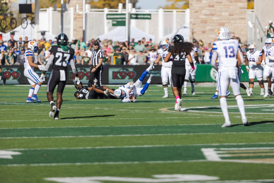 Colorado State University Quarterback Clay Millen tumbles while running the ball