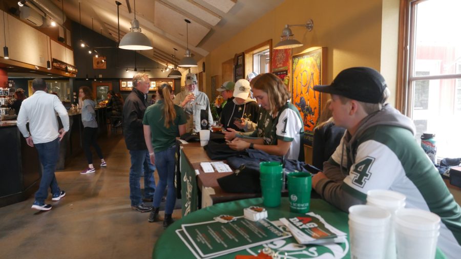 Members of the Colorado State University polo team table at their launch party for the What the Chukker IPA at Odell Brewing Co.