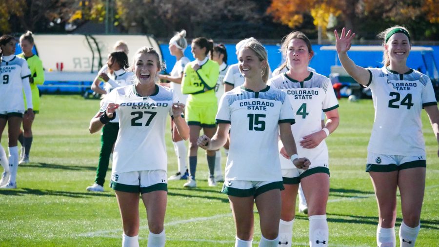 Colorado State senior soccer players Liv Layton and Caroline Lucas smile as they see their families lined up for the senior day festivities Oct. 27.