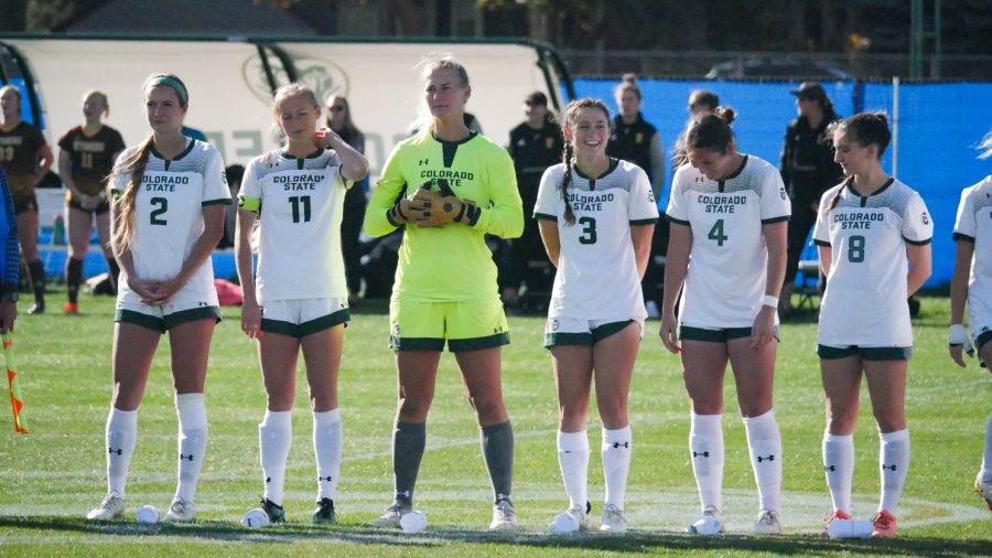 Members of the Colorado State soccer team line up for the national anthem Oct 27.