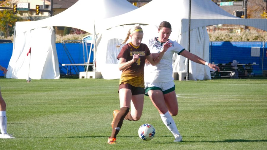 Colorado State senior defender Taylor Bee attempts to steal the ball from Wyoming forward Alyssa Bedard Oct. 27.