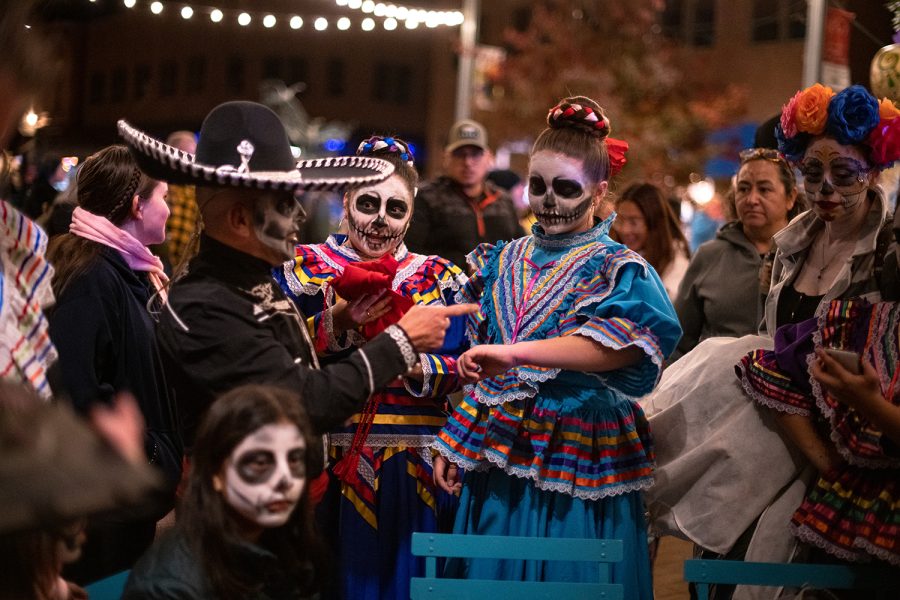 member of the Quetzalcoatl Grupo De Danza finishes an Aztec dance originating from the town Jalisco in Mexico City during the Día de Los Muertos (Day of the Dead) celebration in Old Town Square