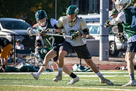 Colorado State University lacrosse players fight for possession