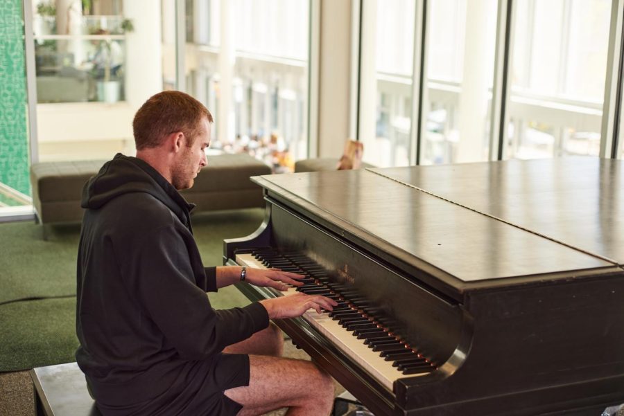 Carter Minter, a senior at Colorado State University, plays the piano