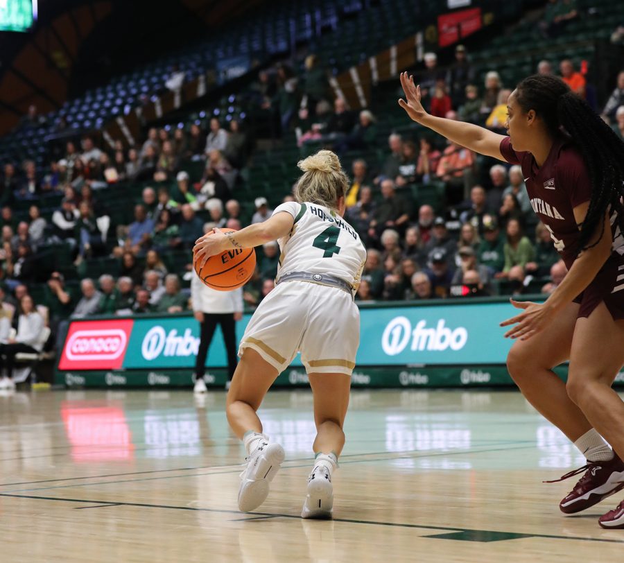 Colorado State University guard McKenna Hofschild (4) dribbles around University of Montana guard Katerina Tsineke (5) at the Rams game against the Lady Griz in Moby Arena Nov. 11, 2022. The Rams achieved their second win of the season, beating the Lady Griz 82-58.