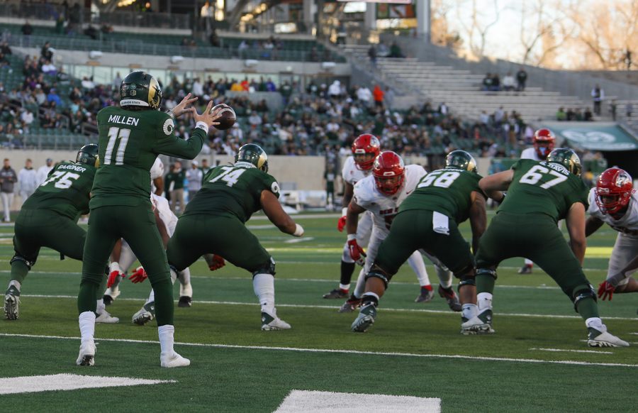 Colorado State University quarterback Clay Millen (11) catches a snap deep in Lobos territory during CSU's game against The University of New Mexico Nov. 25, 2022. CSU won 17-0 at Canvas Stadium in the last game of the 2022 season.