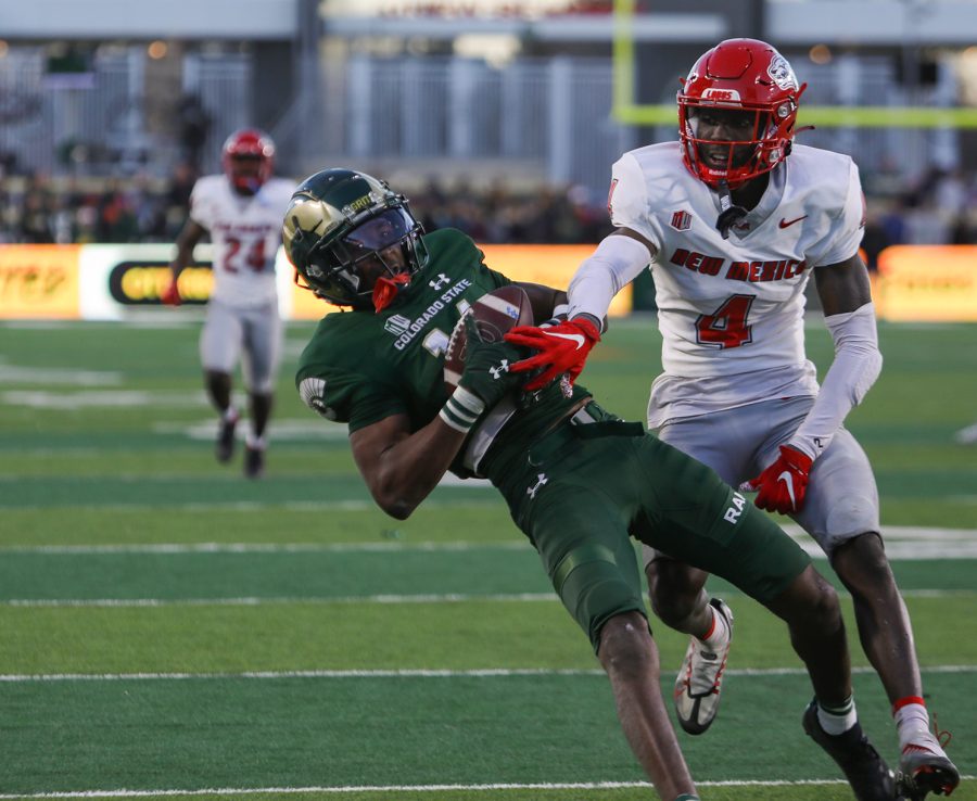 The University of New Mexico cornerback A.J. Odums (4) attempts to stop Colorado State University wide receiver Tory Horton (14) from completing a touchdown Nov. 25, 2022. CSU beat UNM 17-0 at Canvas Stadium, ending the 2022 season 3-9.