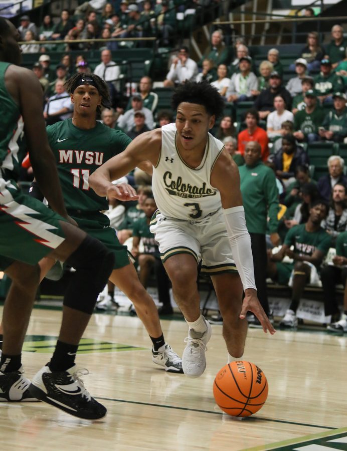 Guard Josiah Strong (3) dribbles under the basket during the Colorado State University basketball game against Mississippi Valley State University at Moby Arena Nov. 26, 2022.