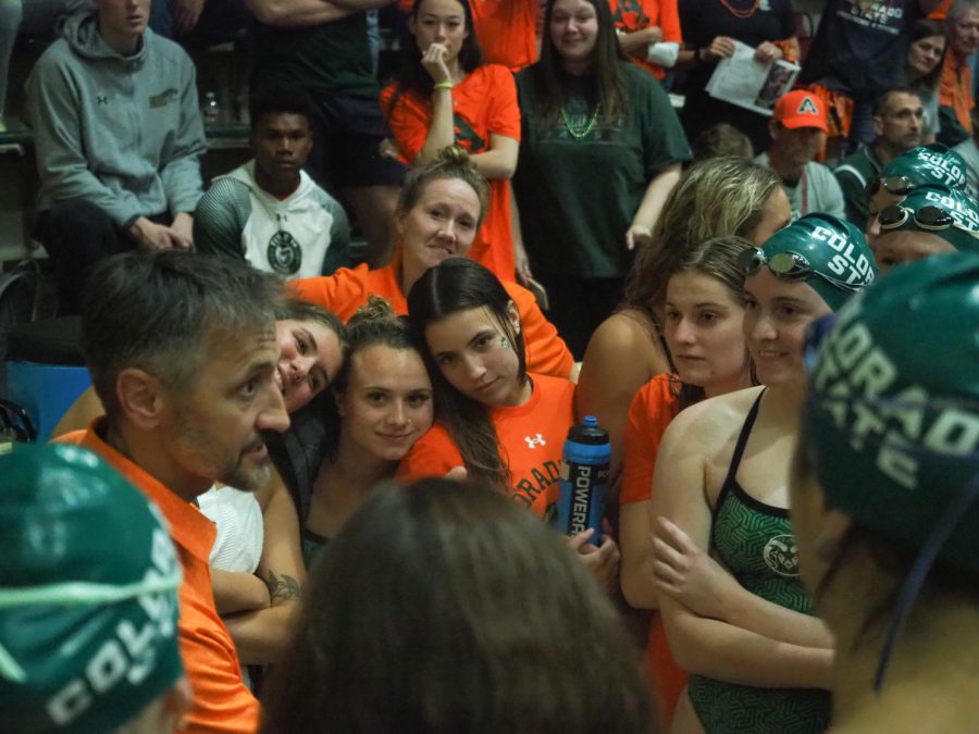 Colorado State swim and dive head coach Chris Woodard talks to his team after they beat Wyoming Nov 5.