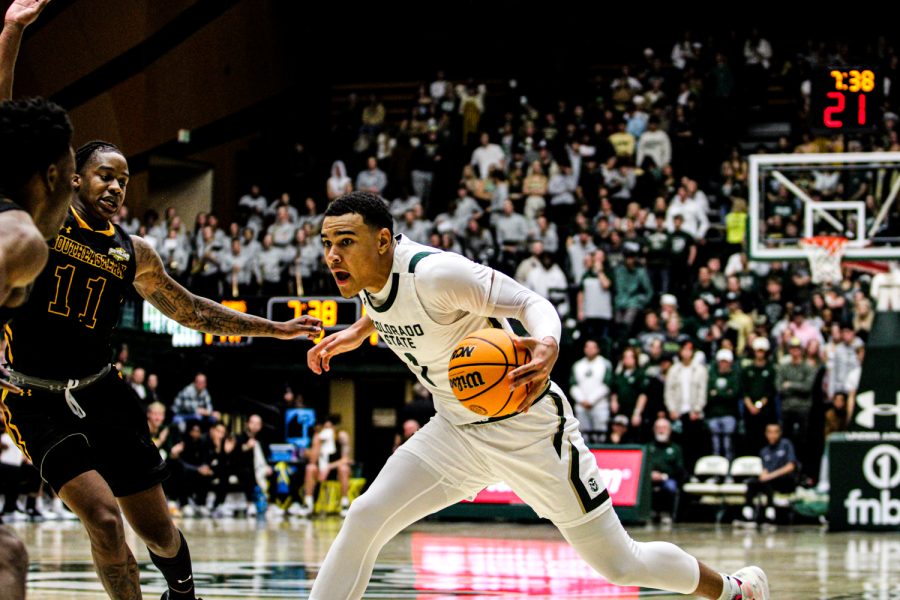 Colorado State guard John Tonje stops on a dime vs two Southeastern Louisiana defenders Nov 11