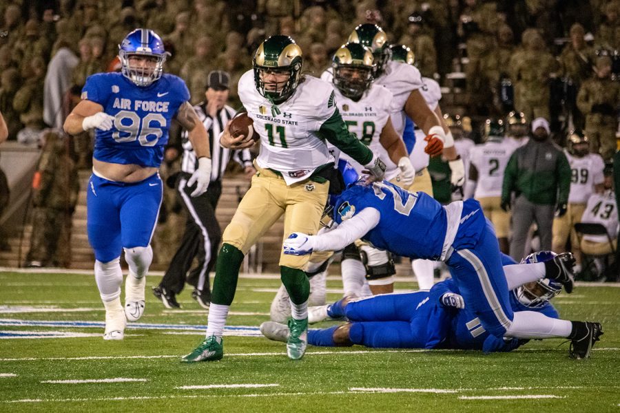 Colorado State University quarterback Clay Millen (11) escapes a sack against the United States Air Force Academy Nov. 19 at Falcon Stadium. The Rams lost the game 24-12.