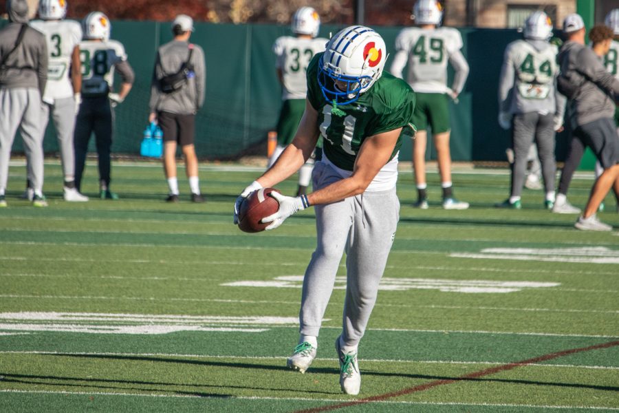 Safety Henry Blackburn (11) secures a catch during practice